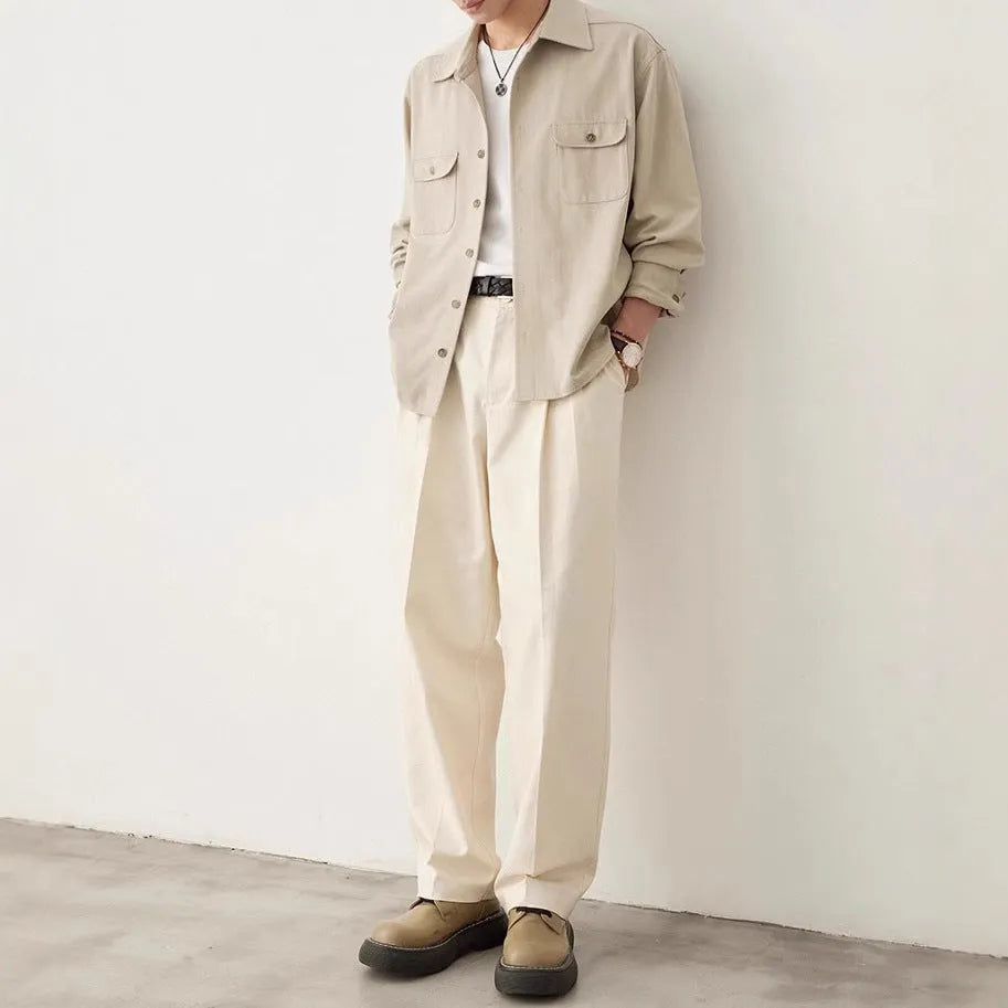 Men's light sand rice long sleeve collared shirt with collage stitch detailing on front.