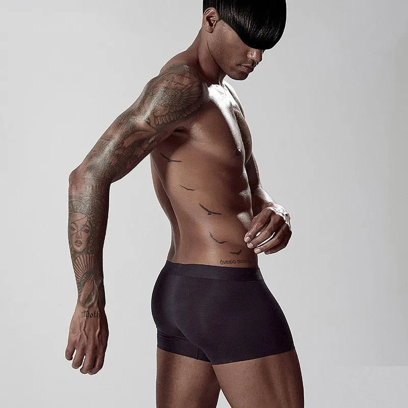 Seamless modal men's underwear in green colour showing mid-waist design