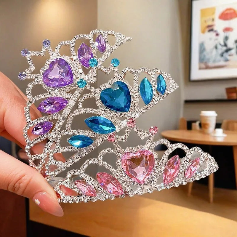 Close-up of a children's metal hairband headdress with a crown pattern in a light purple crystal colour.