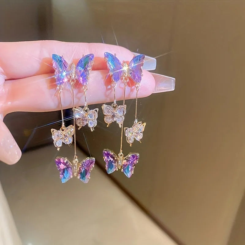 Silver needle crystal flowers butterfly tassel earrings in blue purple colour on alloy backing