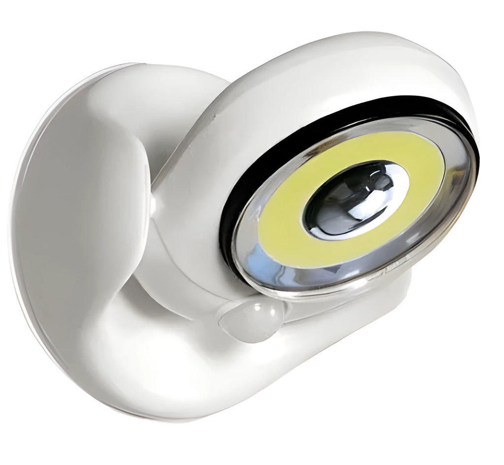 White Atomic Angel induction light unit on a surface, showing its compact 13.3cm by 9.8cm by 15.8cm dimensions.