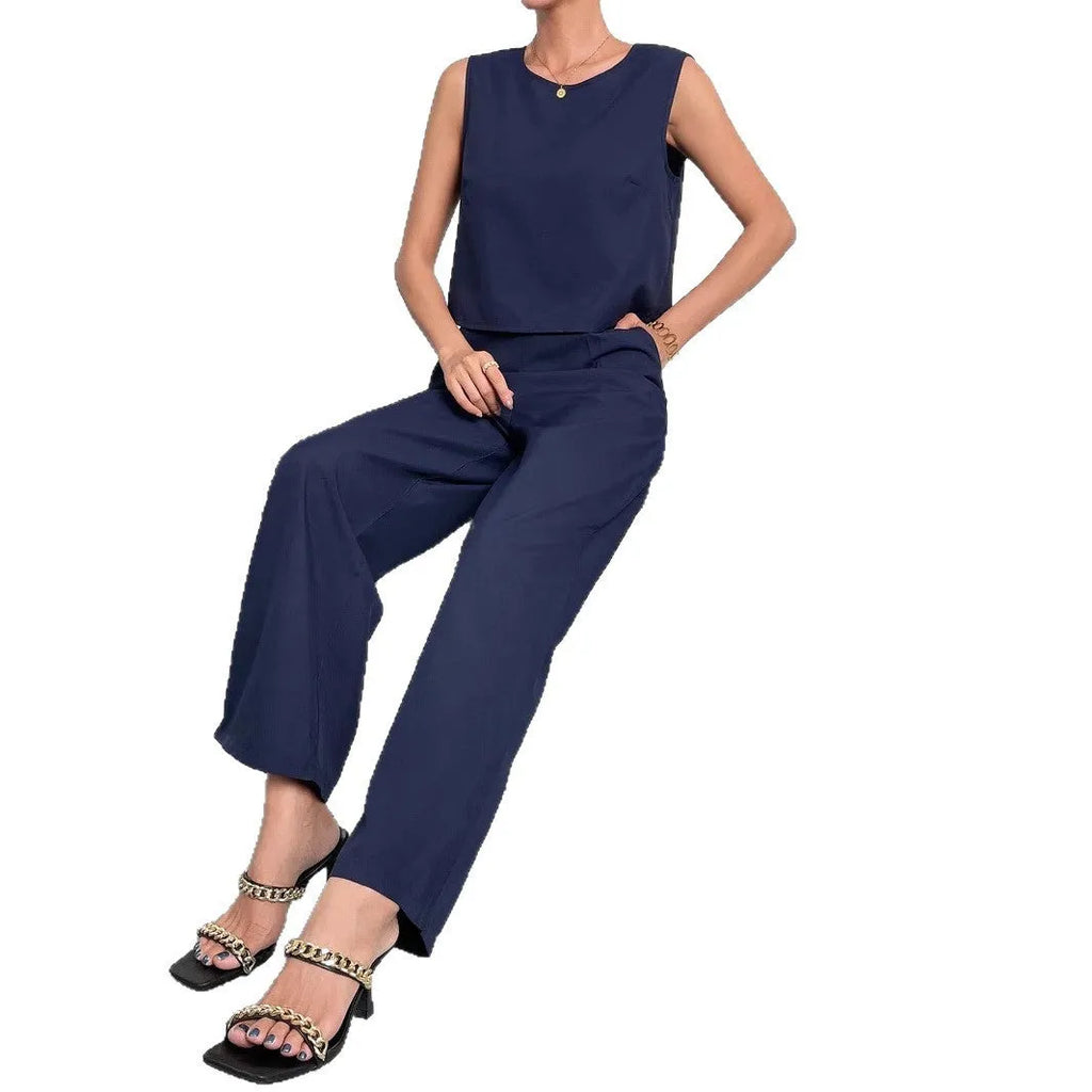 Red polyester two-piece set with sleeveless top and wide leg trousers