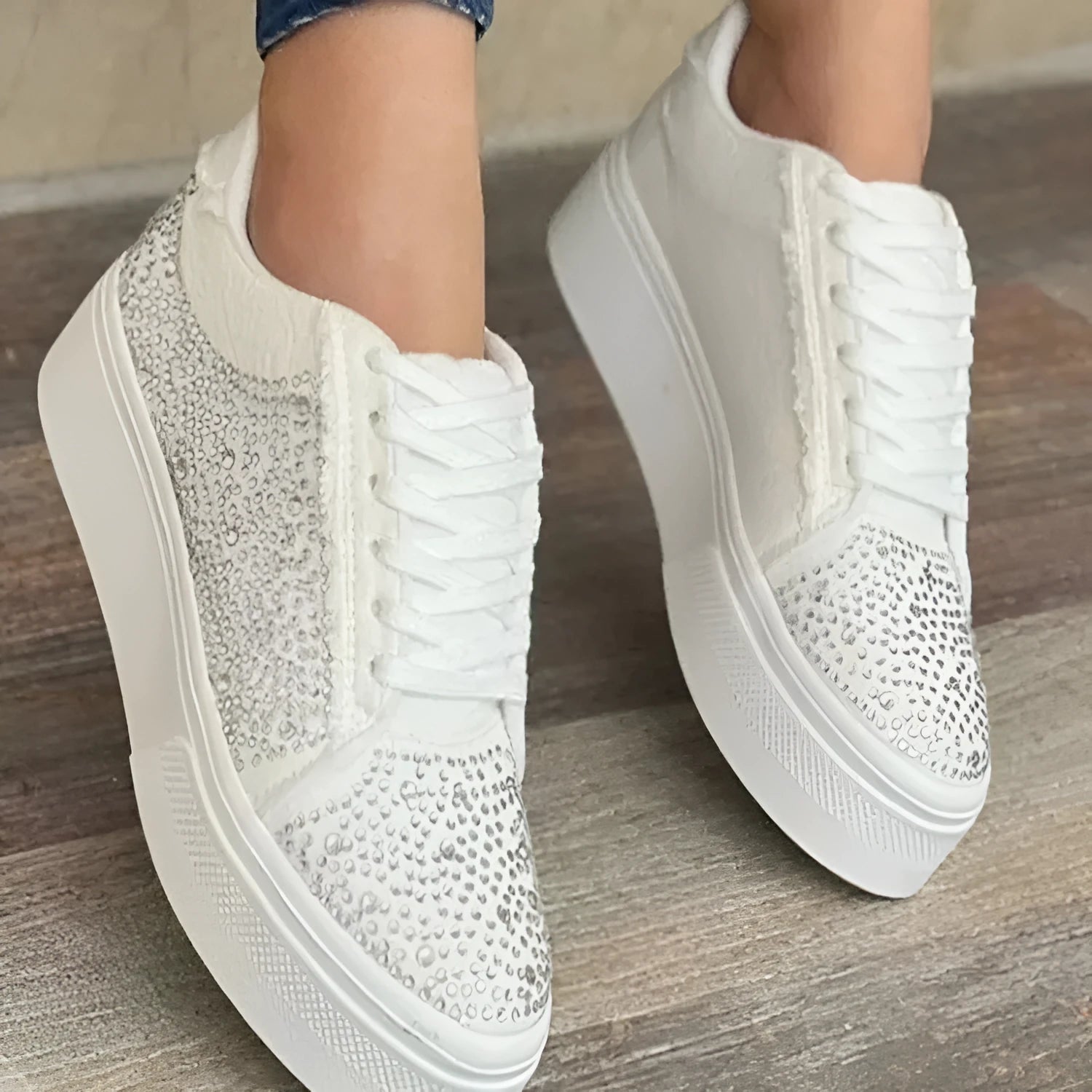 Plus size women's black lace-up casual shoes with rhinestones on the side and a thick rubber sole.