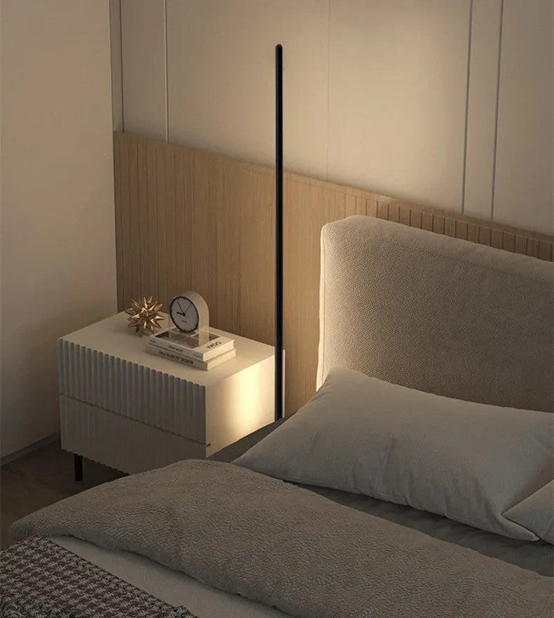 Tall, slim aluminium alloy vertical floor lamp with a LED light source on a modern stand.