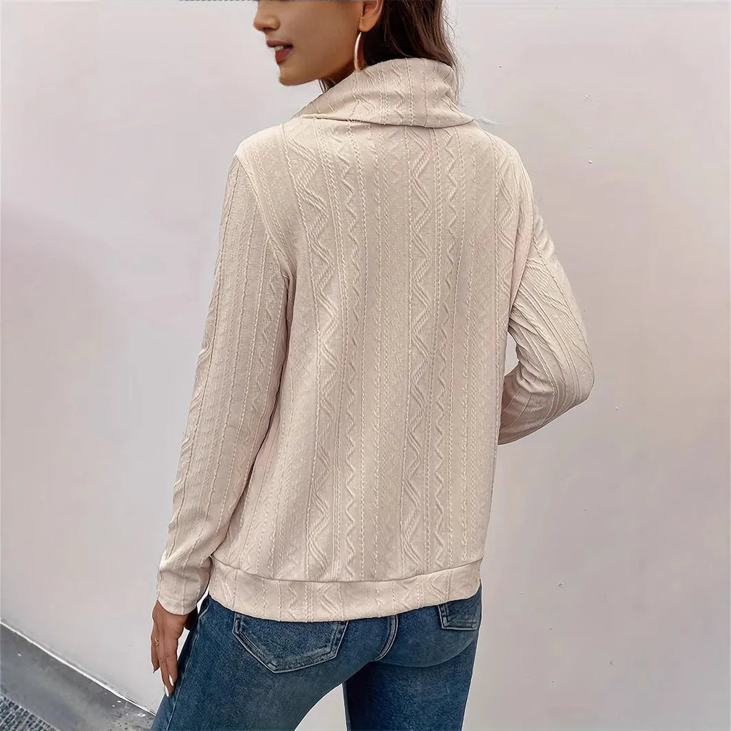 Apricot coloured long sleeve hooded pullover sweater with a drawstring.