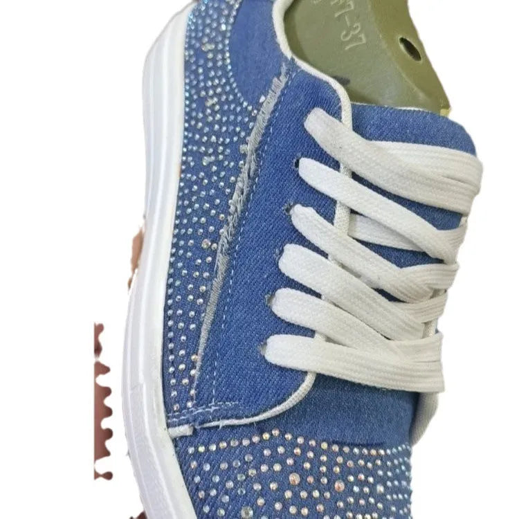 Plus size women's black lace-up casual shoes with rhinestones on the side and a thick rubber sole.