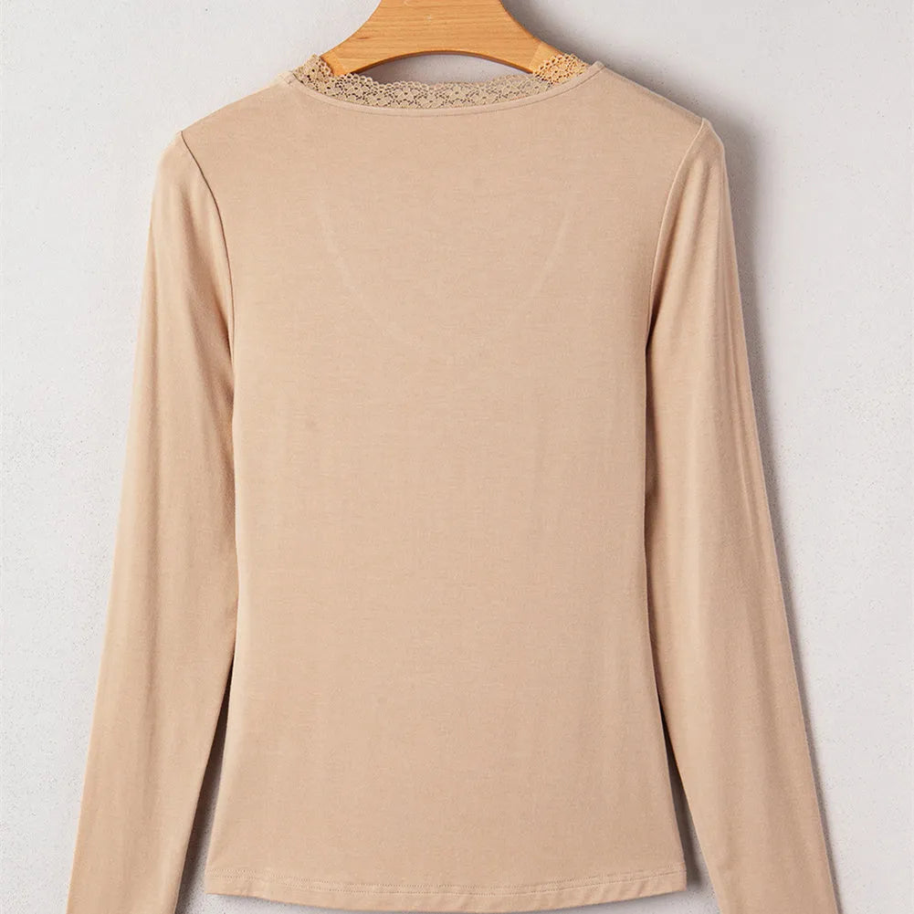 Women's red slim fit long sleeve top with white lace trim on the sleeves.