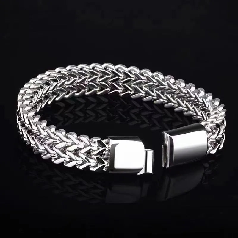Silver titanium steel men's geometric hip hop bracelet shown on a wrist.