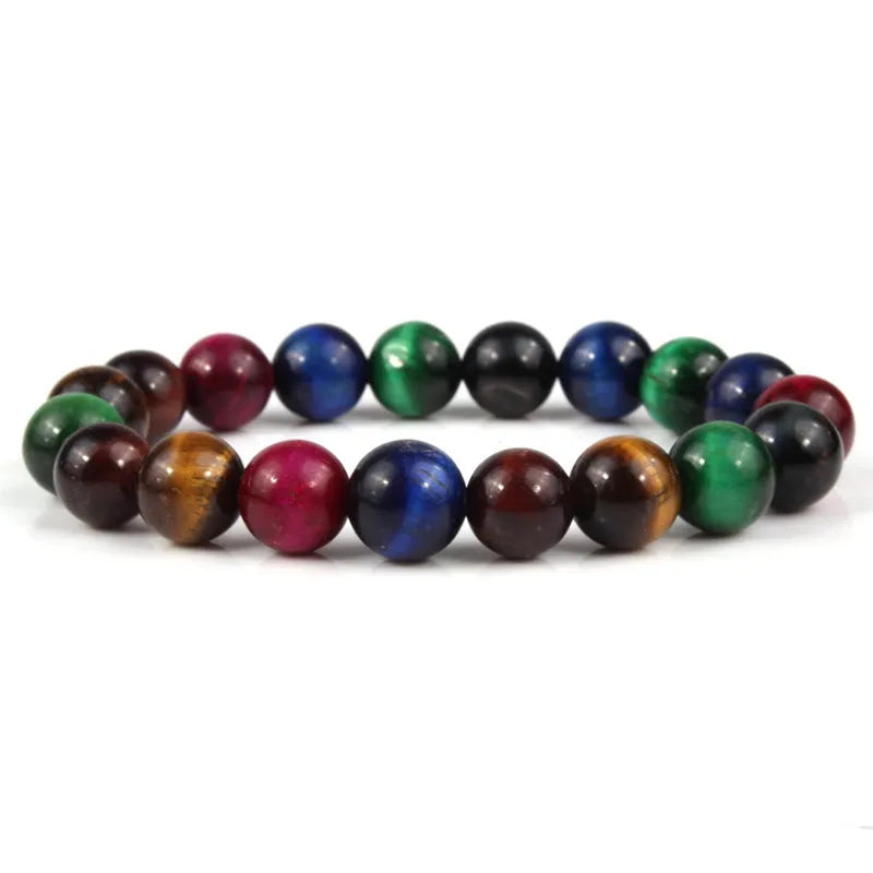 Natural tigereye crystal beaded bracelet with round beads, shown in a selection of colours and sizes on a wrist.