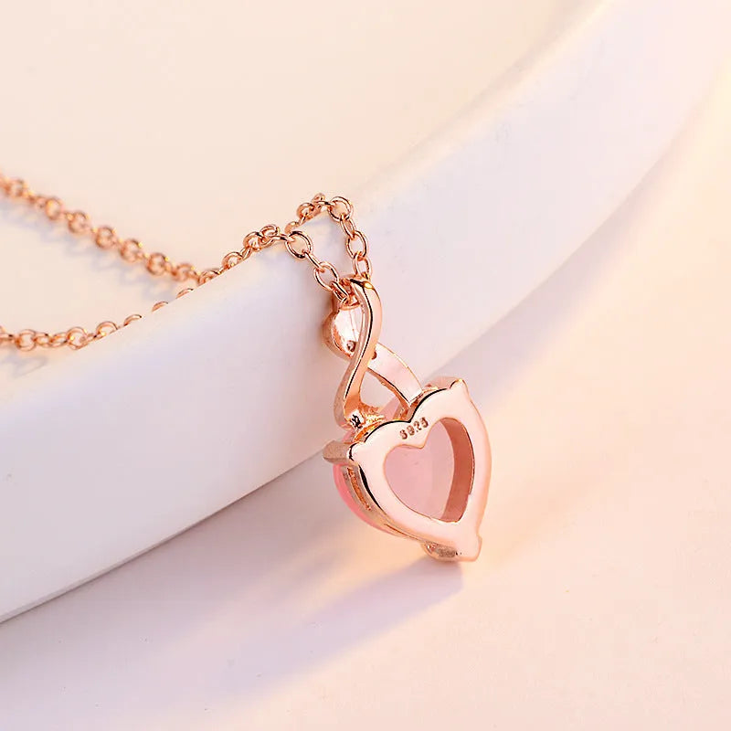 Women's heart-shaped pink crystal pendant necklace with rose gold electroplated cross chain