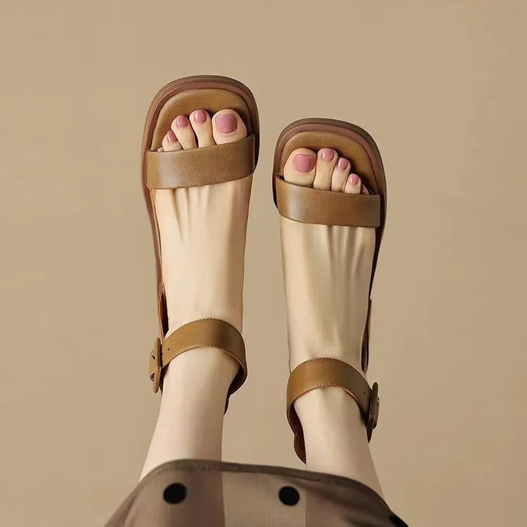 Women's white retro ankle-strap platform high heels with a round toe.
