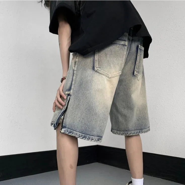 Blue retro-style denim shorts with a wide-leg, loose fit on a person.