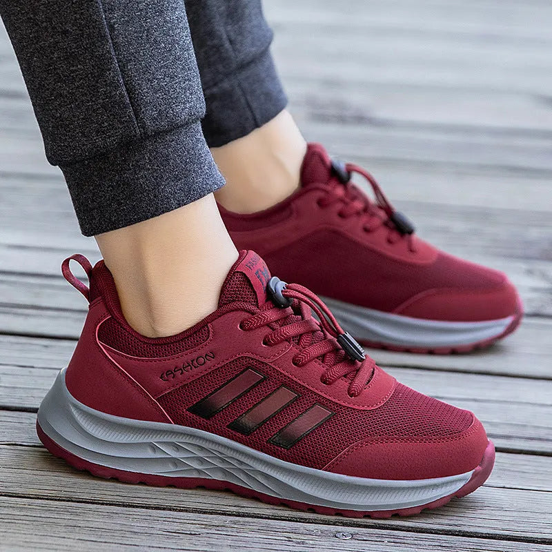 Breathable mesh elastic slip-on casual shoes for men and women in purple, black, and grey.