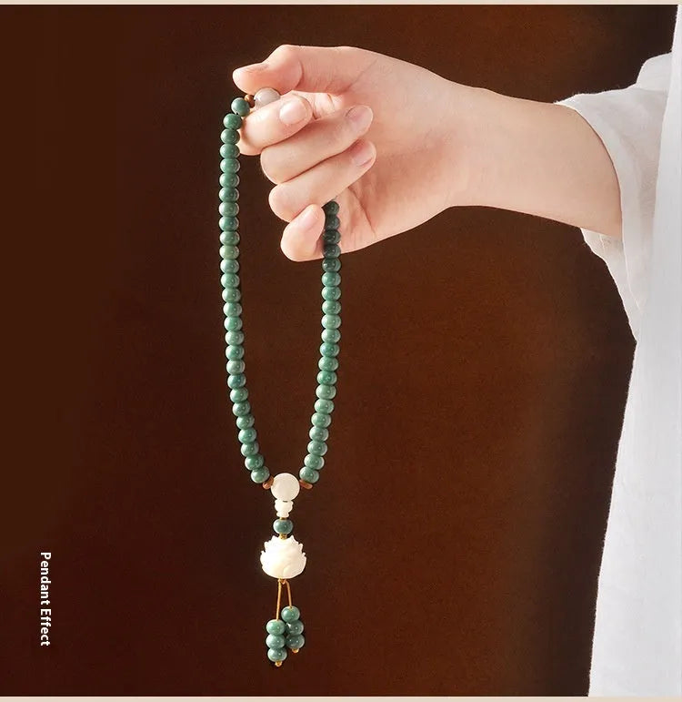 Bodhi seed bracelet with double ring safety buckle and lotus design on round beads