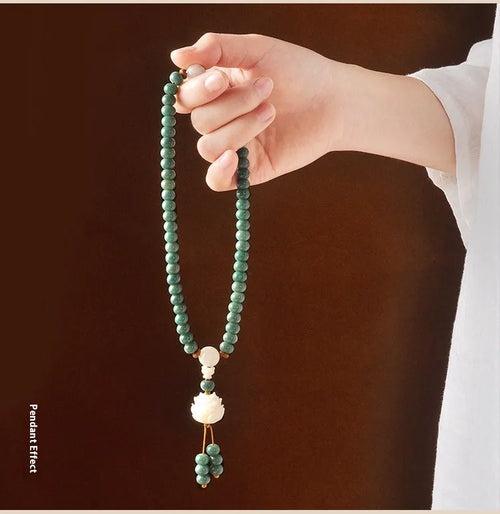 Bodhi seed bracelet with double ring safety buckle and lotus design on round beads