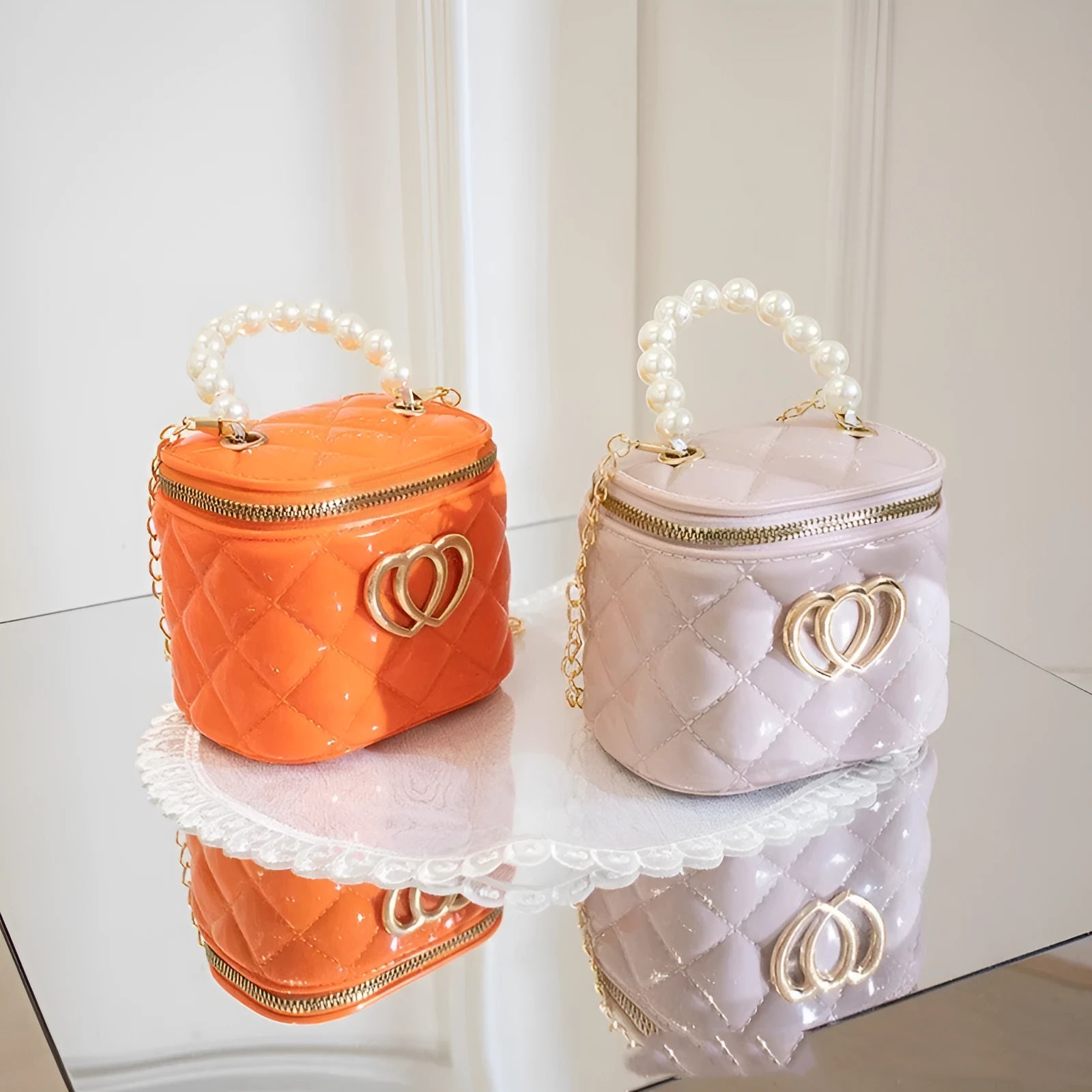 White PVC bucket shoulder bag with a heart-shaped pattern, showing its jelly-like material.