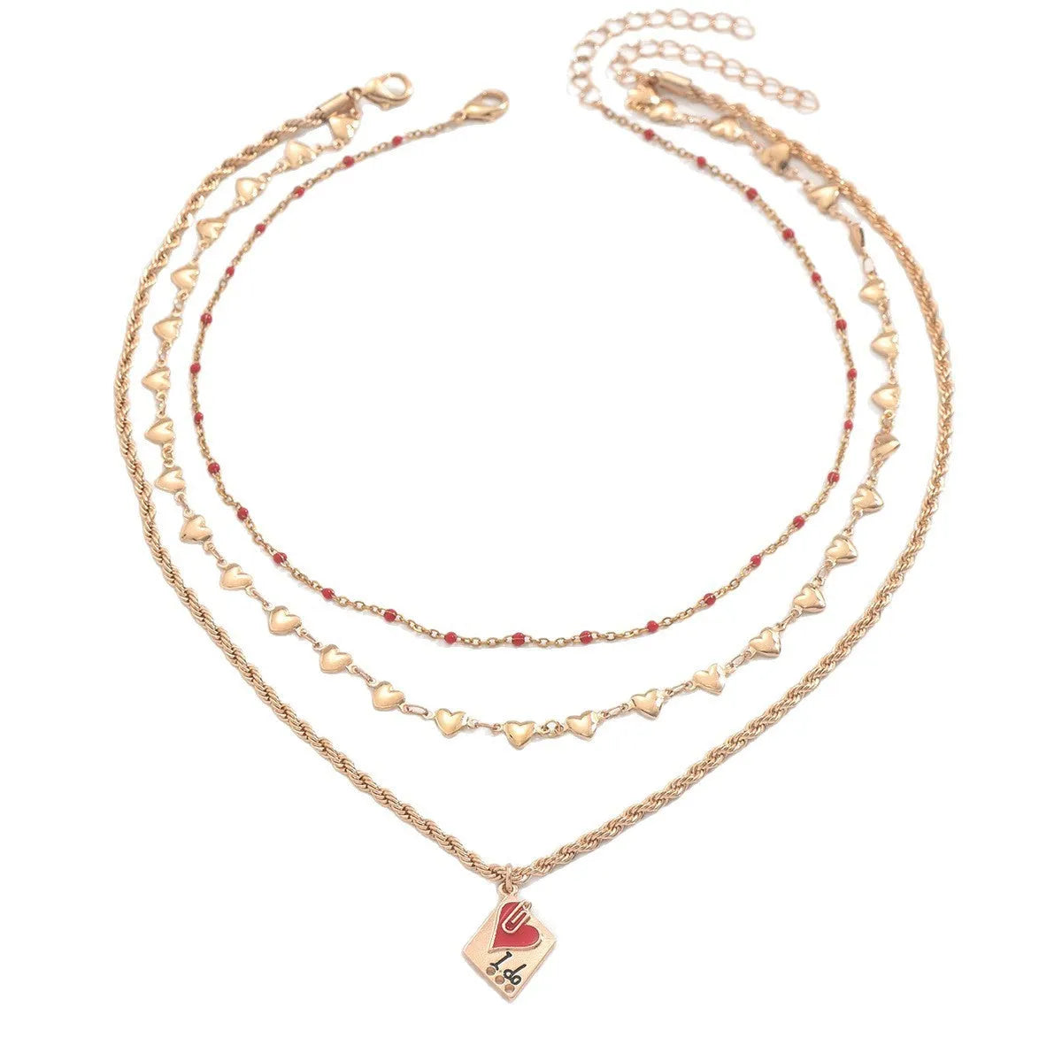 Close-up of a three-layer zinc alloy clavicle chain necklace with geometric shapes and a heart pendant.