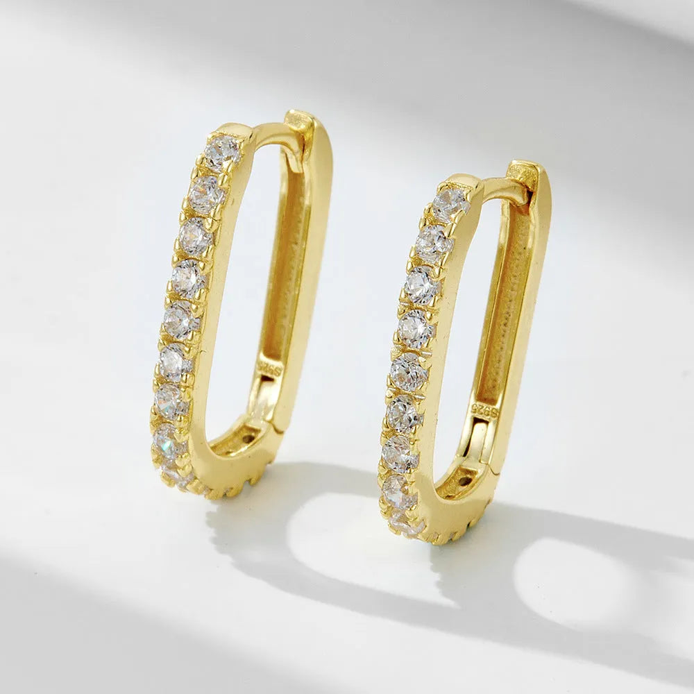 Sterling silver oval zircon ear clips with geometric design in yellow or white silver finishes