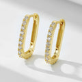 Sterling silver oval zircon ear clips with geometric design in yellow or white silver finishes