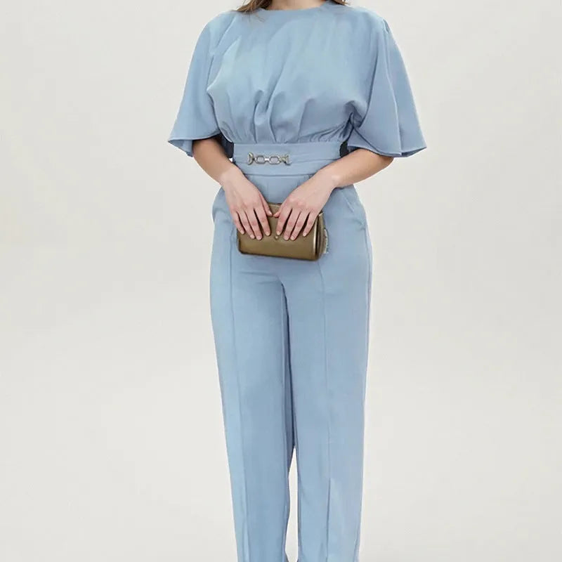 Blue men's polyester business suit with trousers and long-sleeved jacket on a hanger
