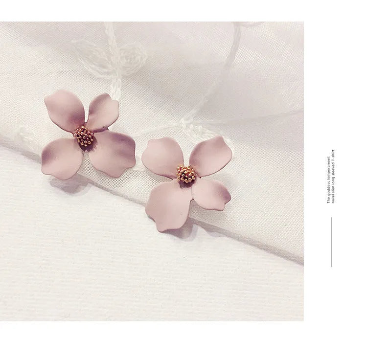 Flower shaped stud earrings for women in pink or white electroplated alloy