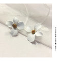 Flower shaped stud earrings for women in pink or white electroplated alloy