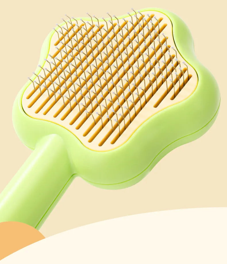 Self-cleaning pet grooming comb with stainless steel needles showing green colour option