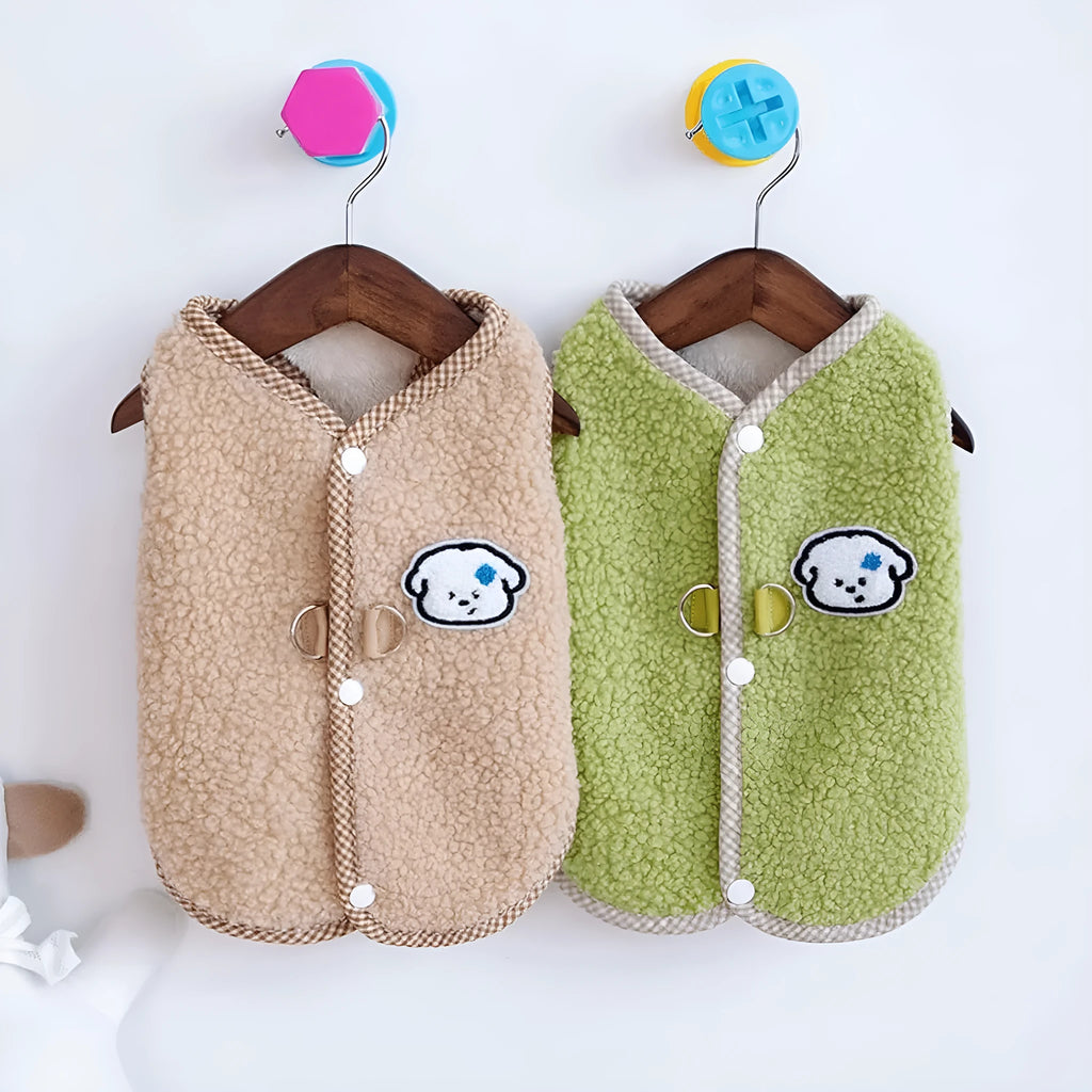 Green thickened coral fleece dog vest with a metal leash ring on the back, laid flat.