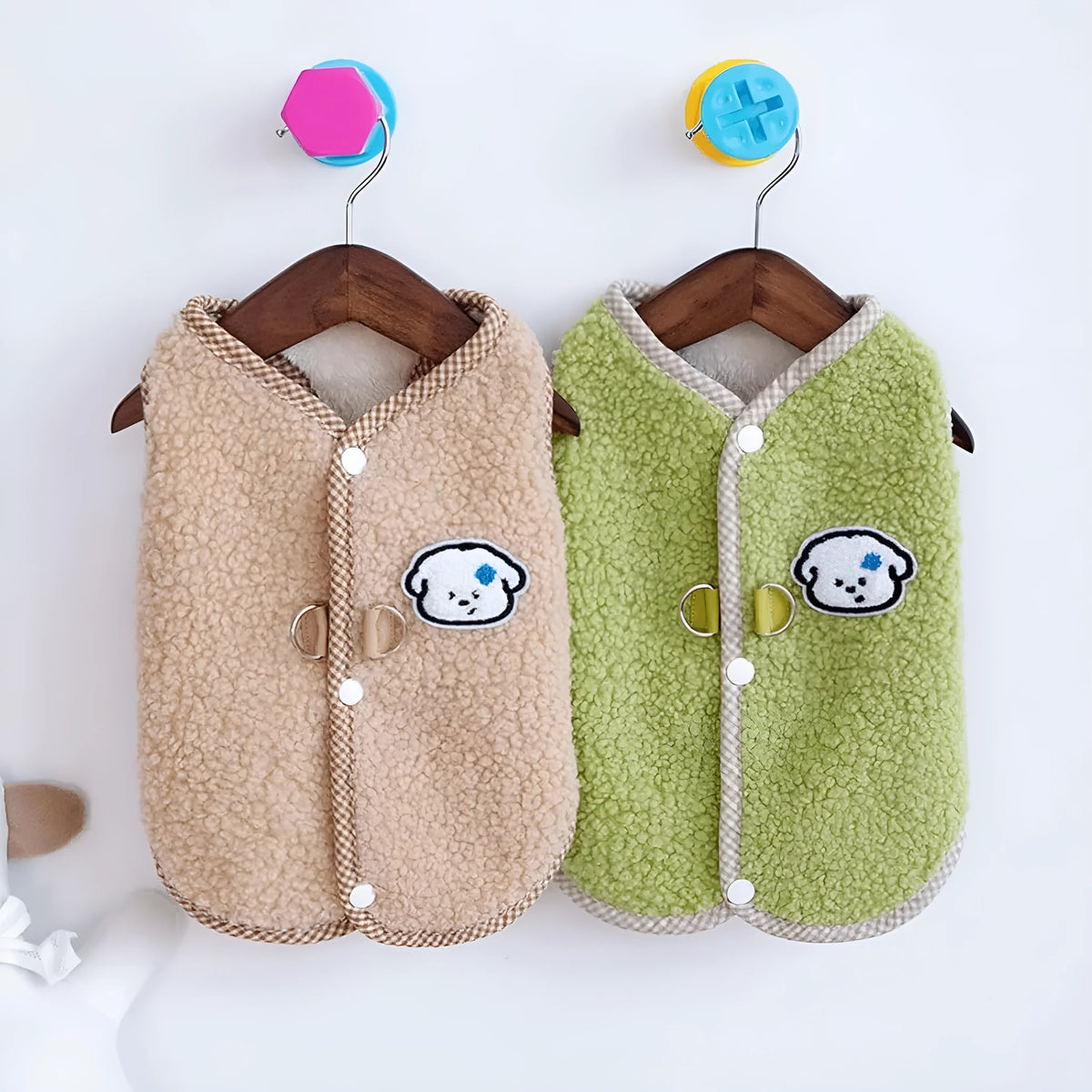 Green thickened coral fleece dog vest with a metal leash ring on the back, laid flat.