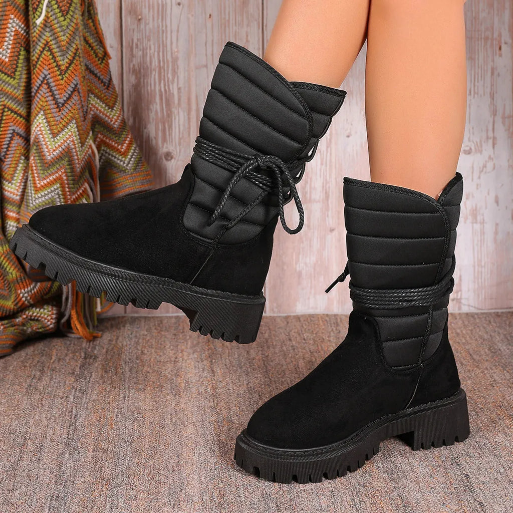 Women's chunky heel snow boots in black with suede upper and lace-up design