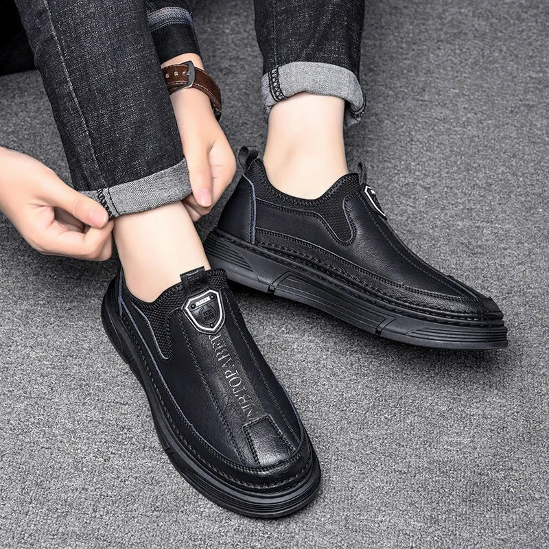 Men's solid colour leather casual shoes with round toe in Black and Brown options.