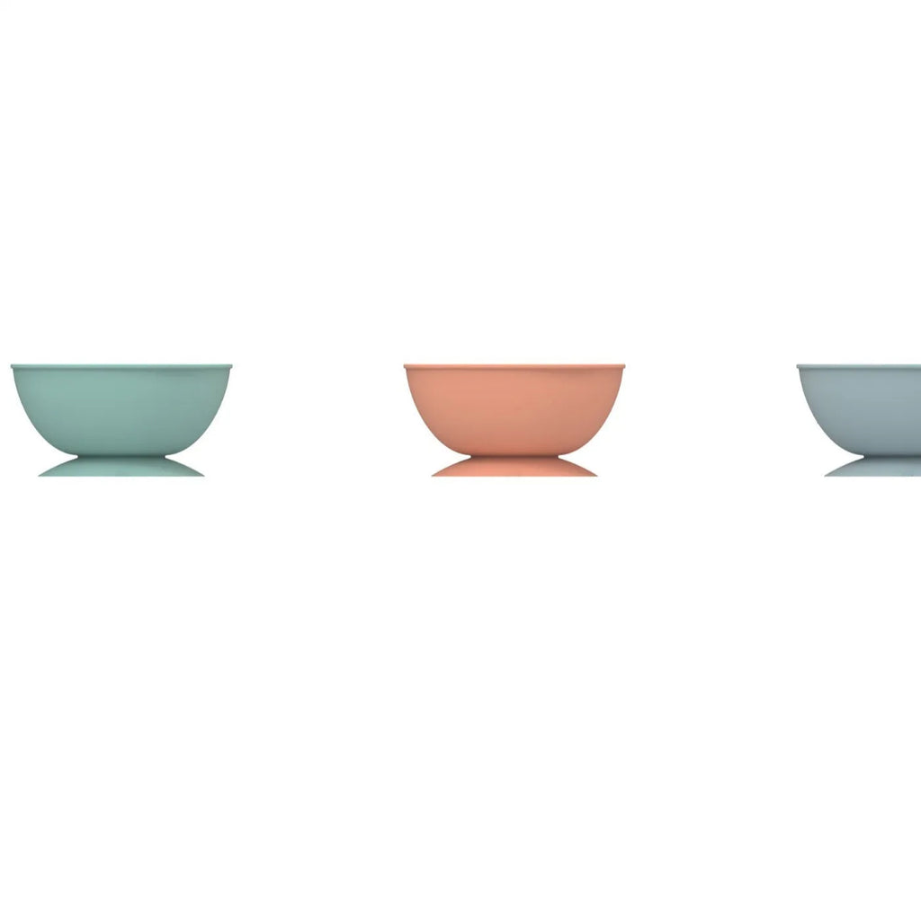 Cyan silicone pet licking mat slow feeding bowl with suction cup base, textured surface patterns