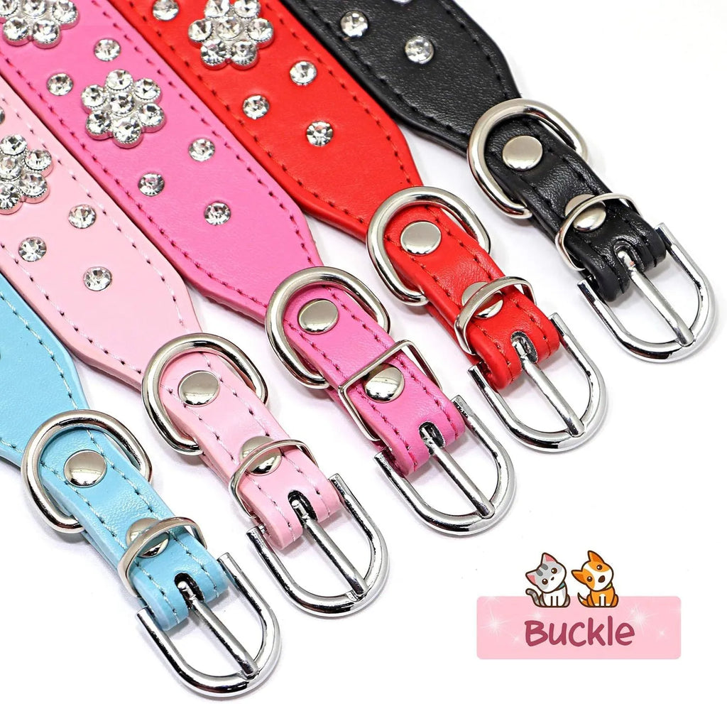 Close-up of a black PU leather dog collar with silver rhinestone flowers and studs, showing the metal D-ring.
