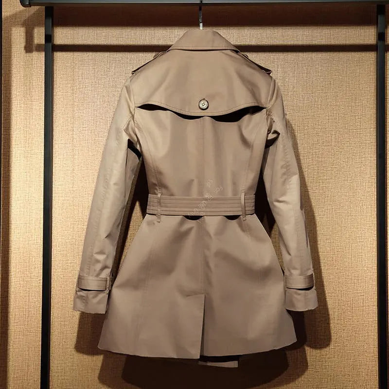 Khaki double-breasted women's trench coat with long flight sleeves and button front.