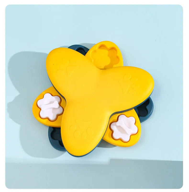 Green and yellow dog puzzle toy with rotatable compartments and bone-shaped covers