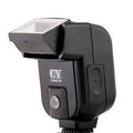 Compact silver SLR camera flash with a rotating head on a hot shoe mount