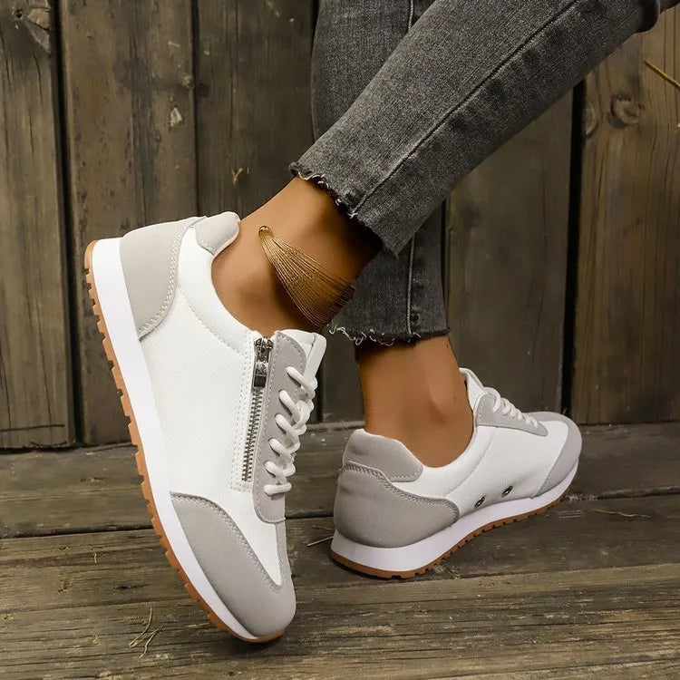 Women's flat-heeled shoes in Champagne, grey, and white with a PU upper and rubber sole.