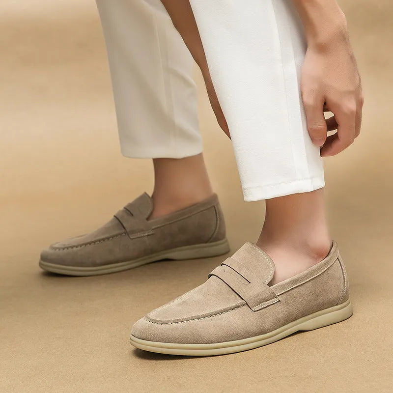 Men's leather slip-on casual shoes in beige with a rounded toe and rubber sole.