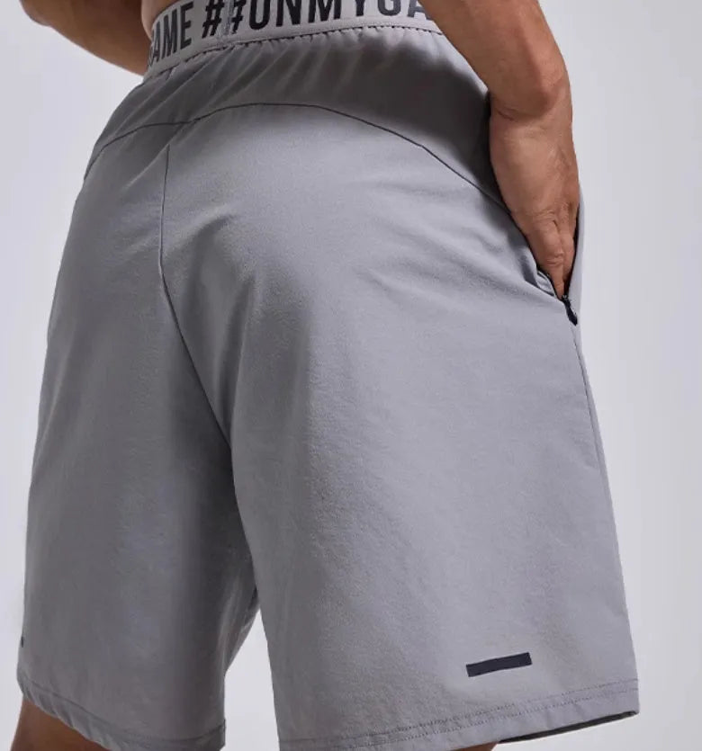Men's loose black athletic shorts with elastic waist for sports and workouts