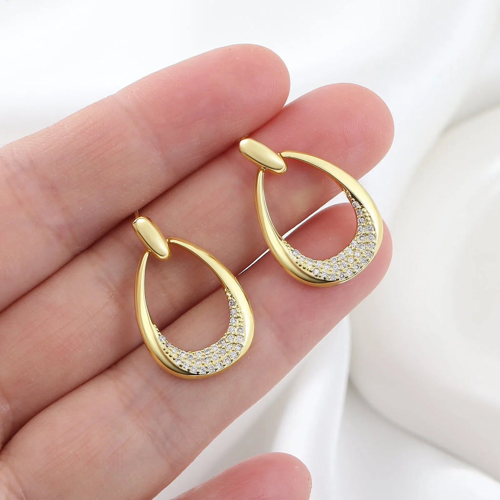 Yellow gold geometric drop earrings with ring design elements measuring 2.6cm