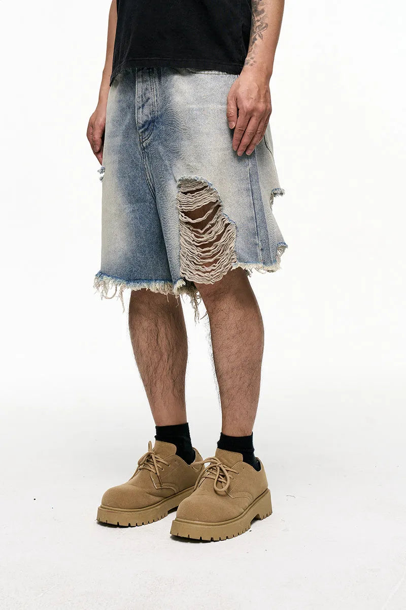 Light blue men's baggy denim shorts with wide leg and zipper fly