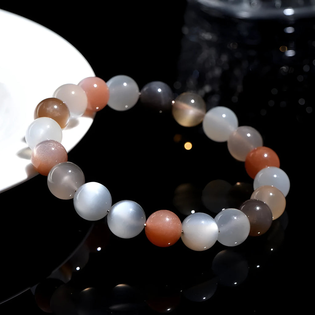 Natural colourful moonstone unisex bracelet with 8mm beads on a wrist.
