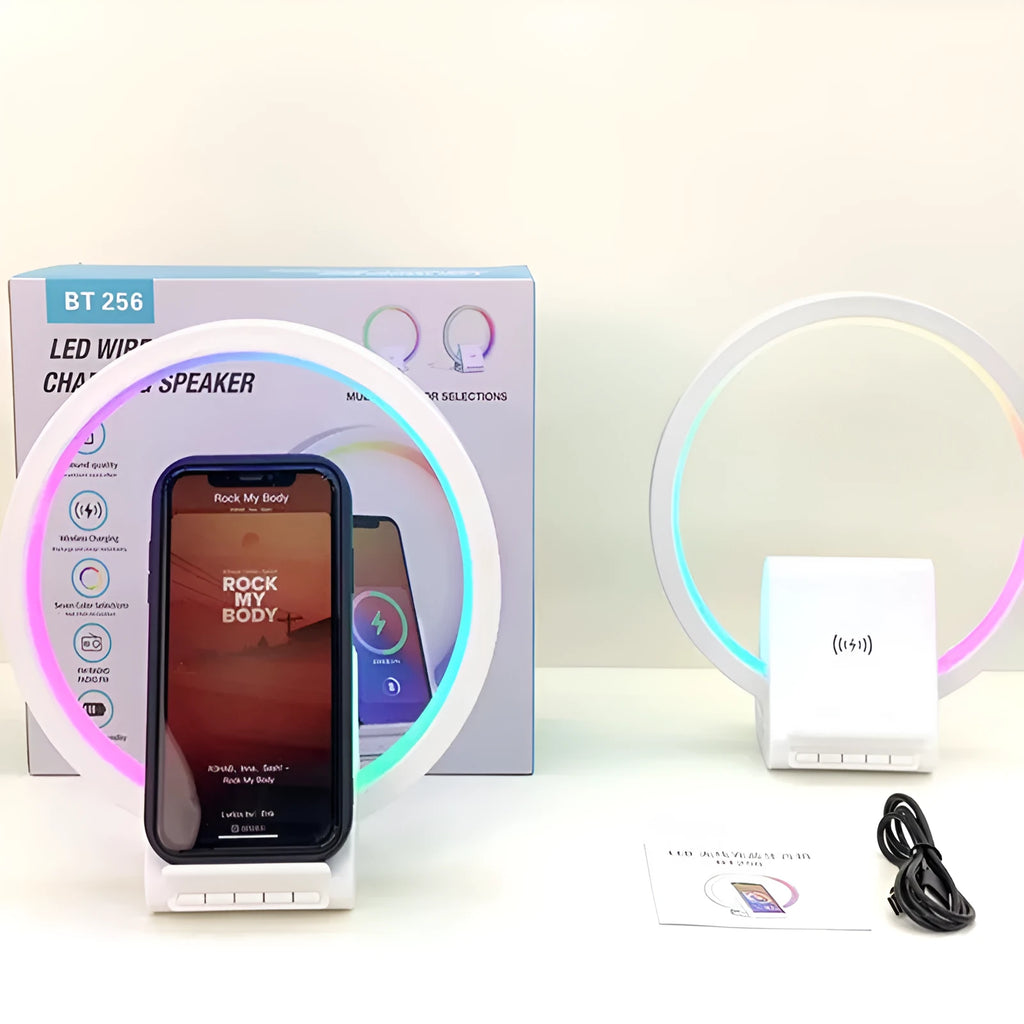 White smart Bluetooth speaker with integrated ambient lighting and a 15W wireless charging pad on top.