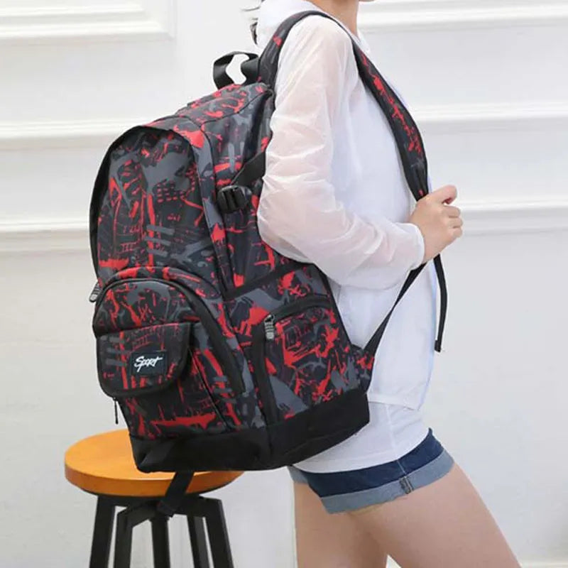 Blue classic nylon backpack with multiple compartments shown on a white background.