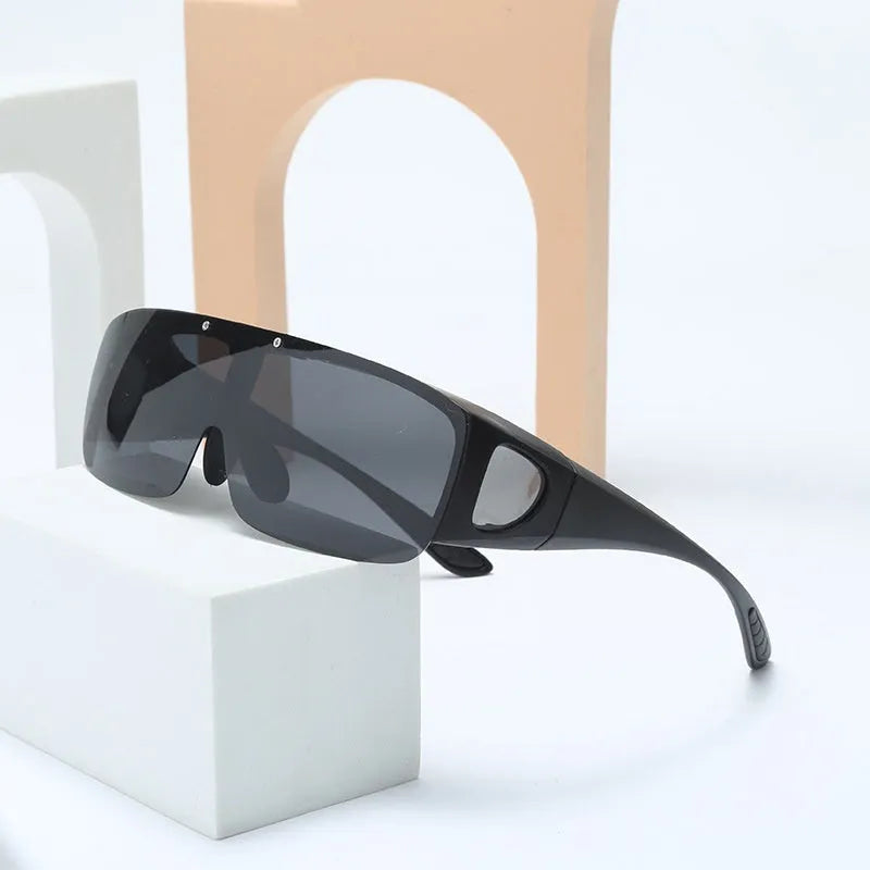 Polarised sports sunglasses with one-piece myopia glasses design for outdoor activities.