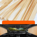 Retractable car sunshade curtain in thick opaque cloth on a roller shutter mechanism