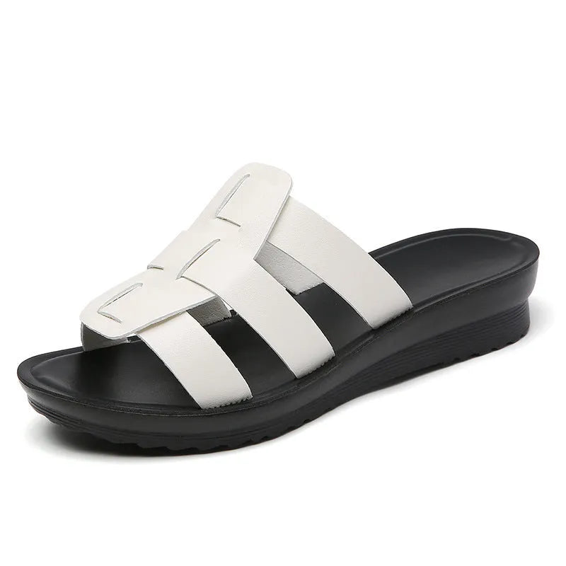 Women's flat bottom slippers with waxed leather upper in beige, black, and brown colours