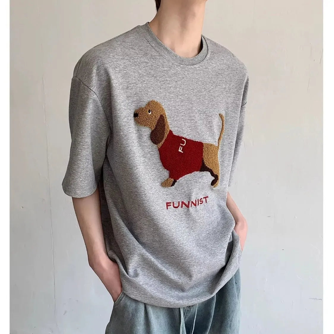 Men's grey T-shirt with embroidered sausage dog design on front, round neck and short sleeves
