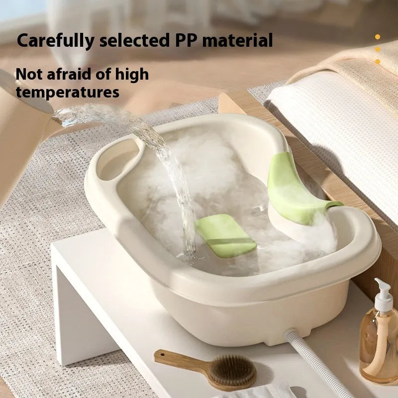 Portable plastic shampoo basin with head pad, circulating pump and massage brush for bed use.