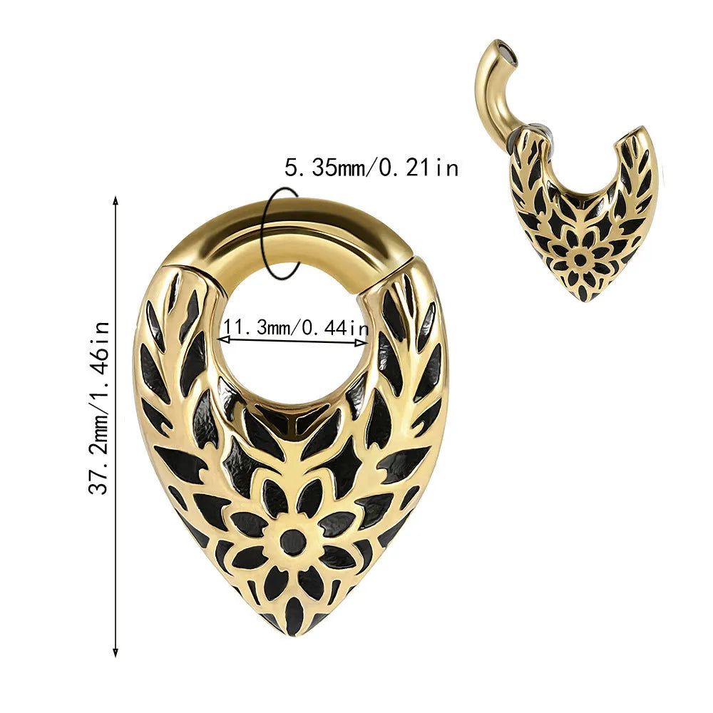 Drop-shaped stainless steel ear extender with totem pattern and hanging egg detail.